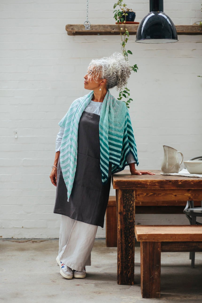 model wearing chevron boulevard shawl draped across shoulders