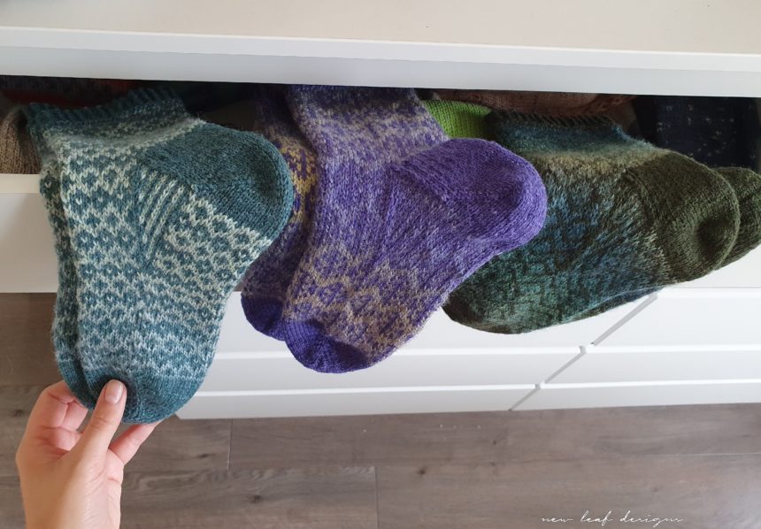 three pairs of socks visible from drawer